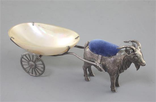 An Edwardian novelty silver billy goat and cart pin cushion, with mother of pearl cart on two 12cm.